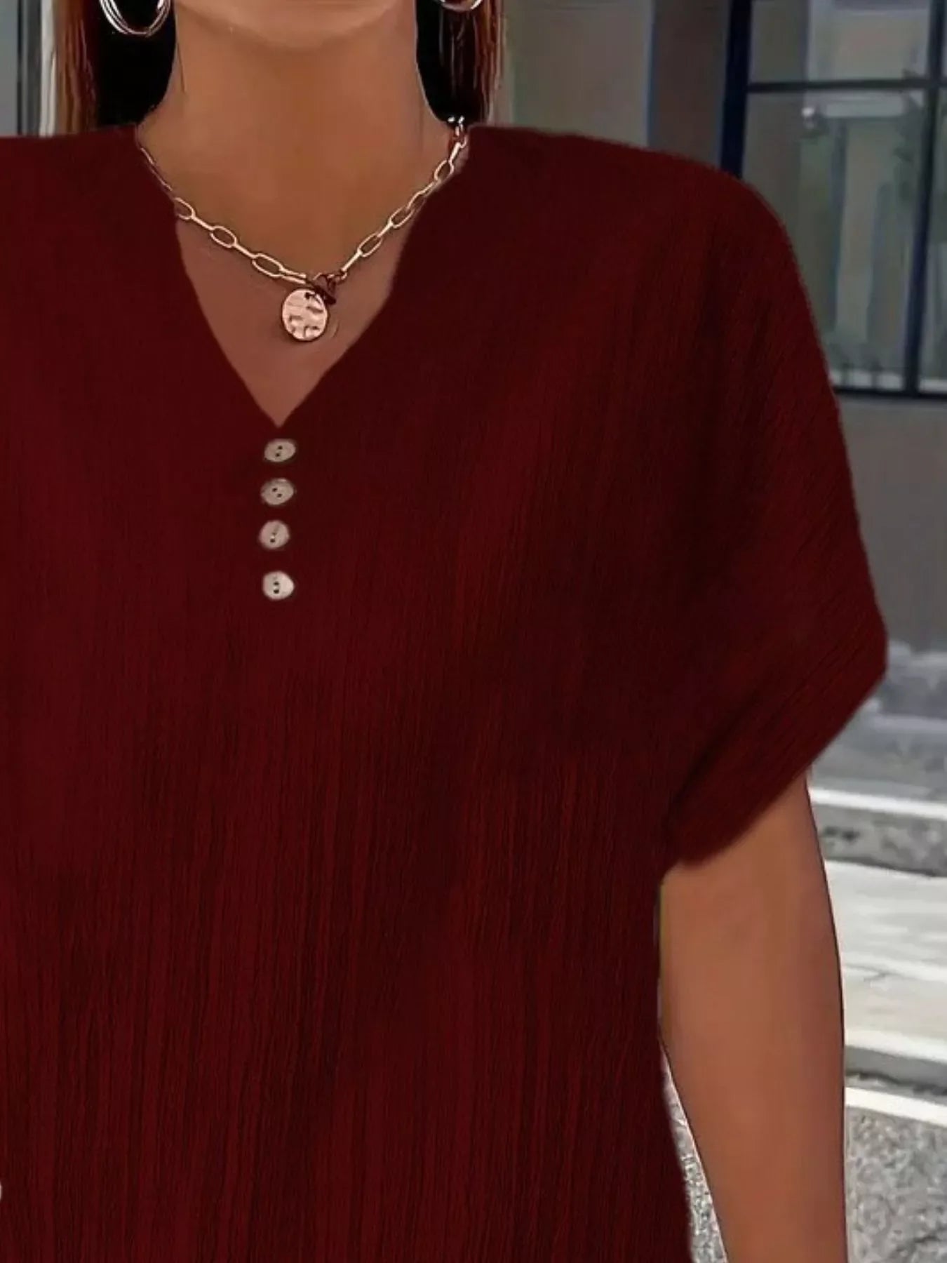 Plus size notched short sleeve textured top with decorative button in 100% polyester