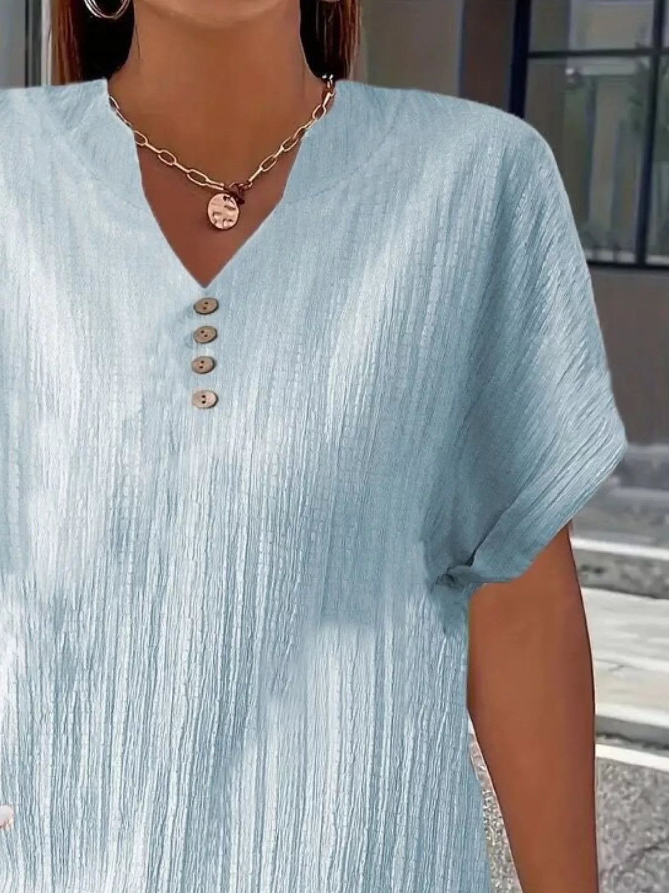 Plus size notched short sleeve textured top with decorative buttons in black