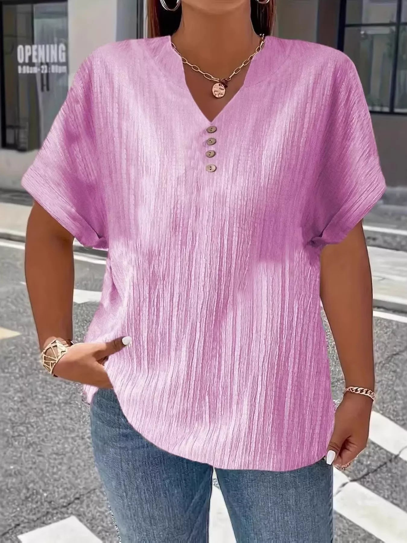 Plus size notched short sleeve textured top with decorative button in 100% polyester