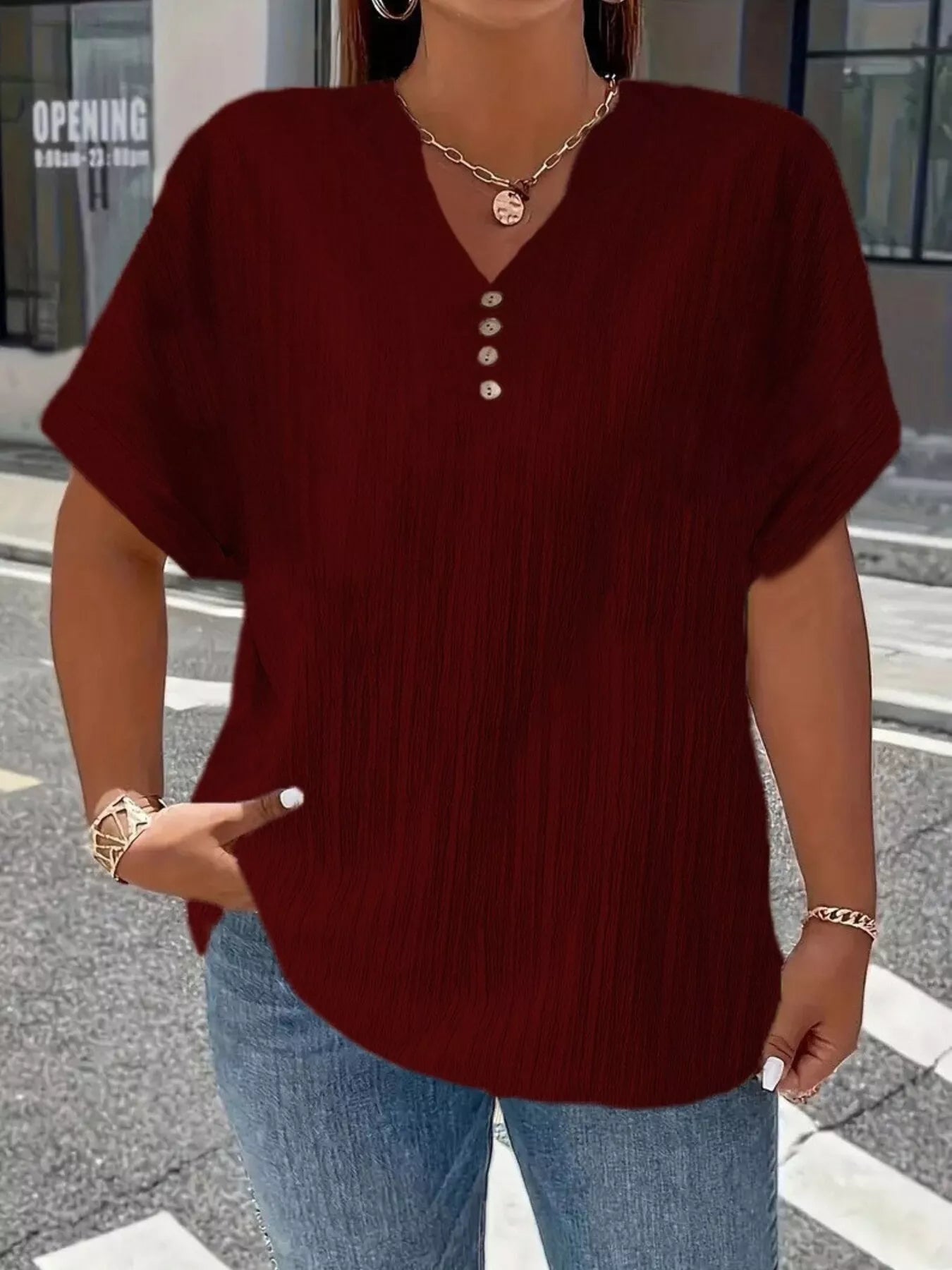Plus size notched short sleeve textured top with decorative button in various 1XL to 5XL sizes