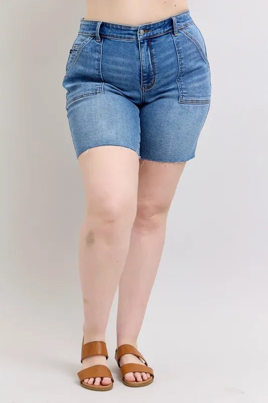 Plus size Judy Blue Full Size mid-rise denim Bermudas shorts with back flap pockets and raw hem