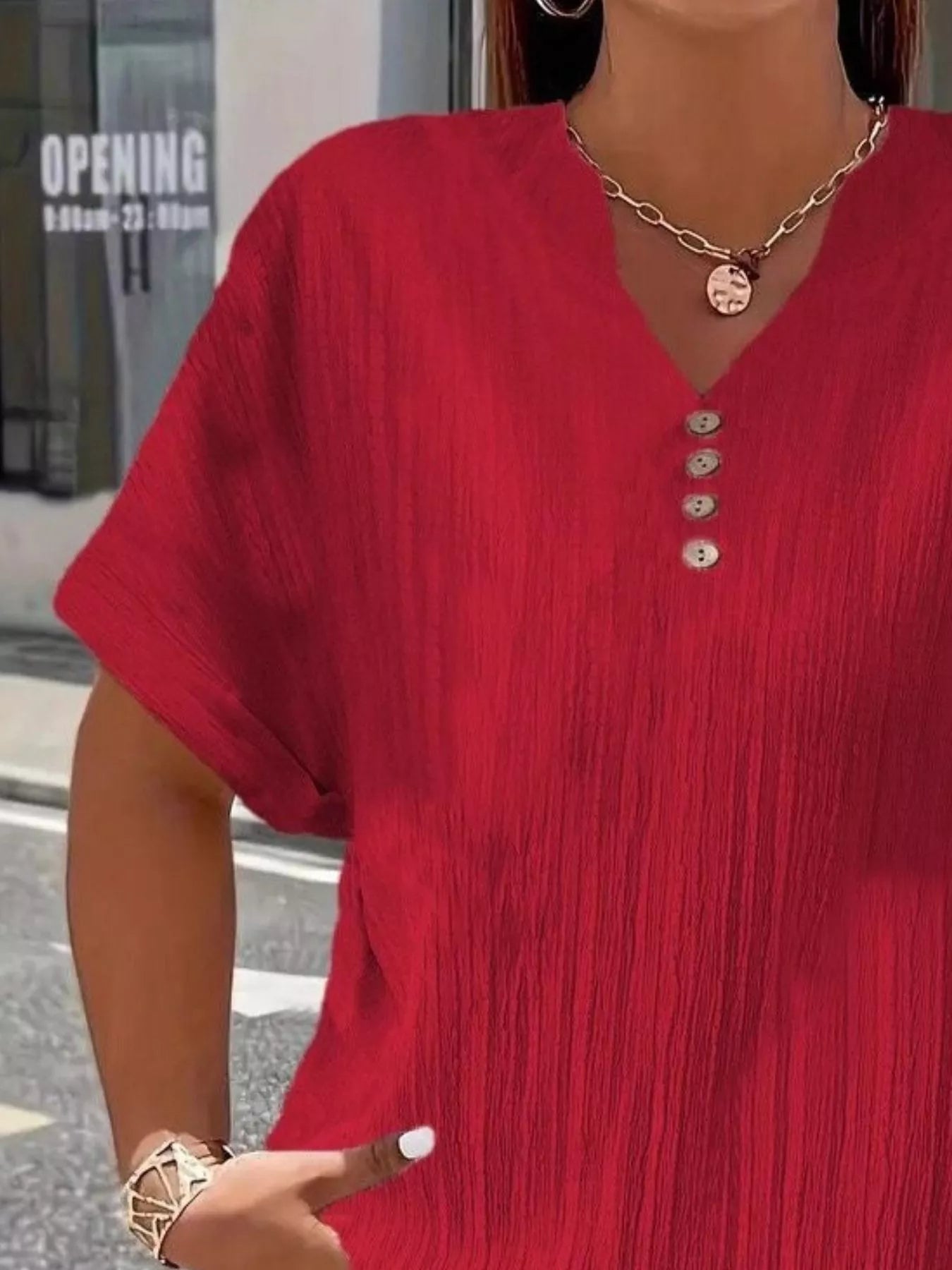 Plus size notched short sleeve textured top with decorative button in 100% polyester