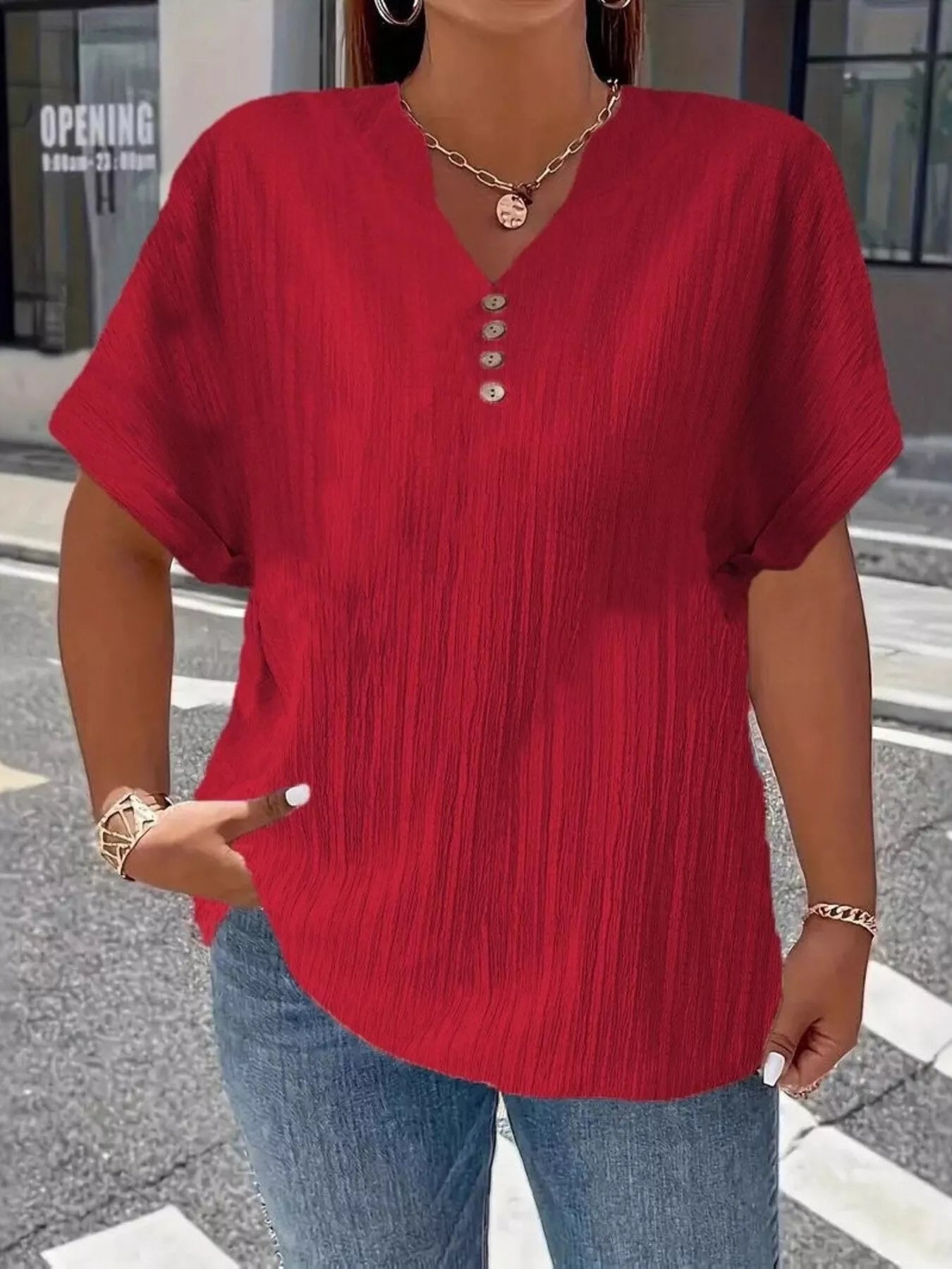 Plus size notched short sleeve textured top with decorative button in 100% polyester
