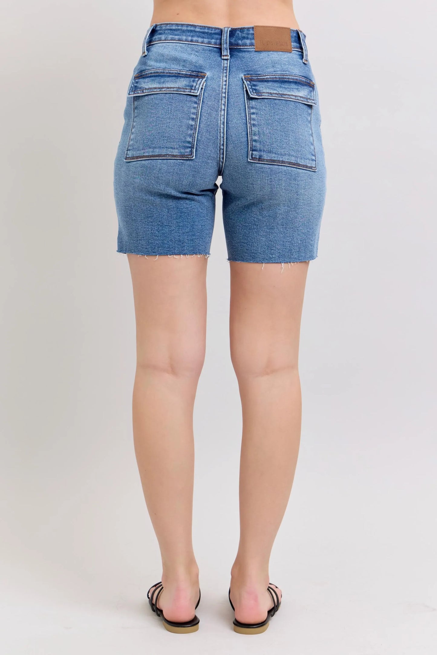 Judy Blue full size mid rise bermudas denim shorts with back flap pockets and raw hem