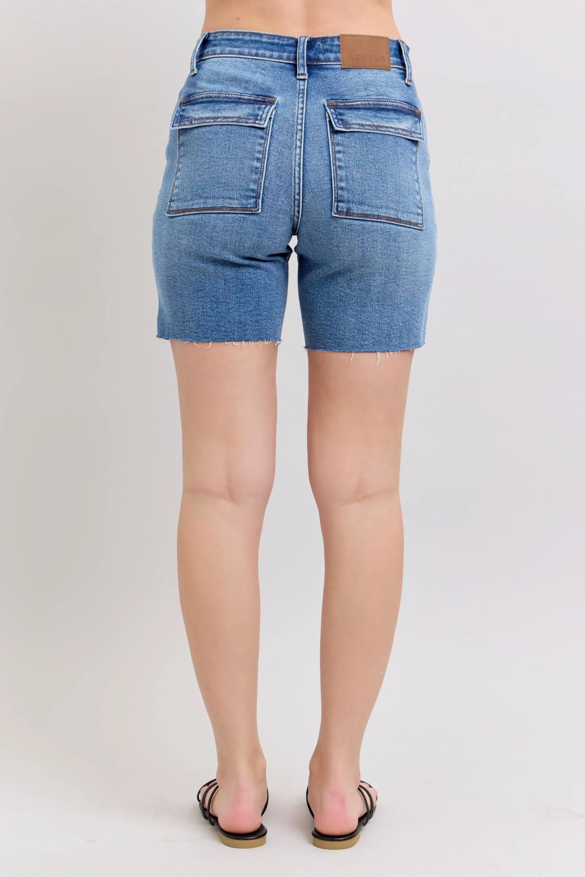 Judy Blue full size mid rise bermudas denim shorts with back flap pockets and raw hem