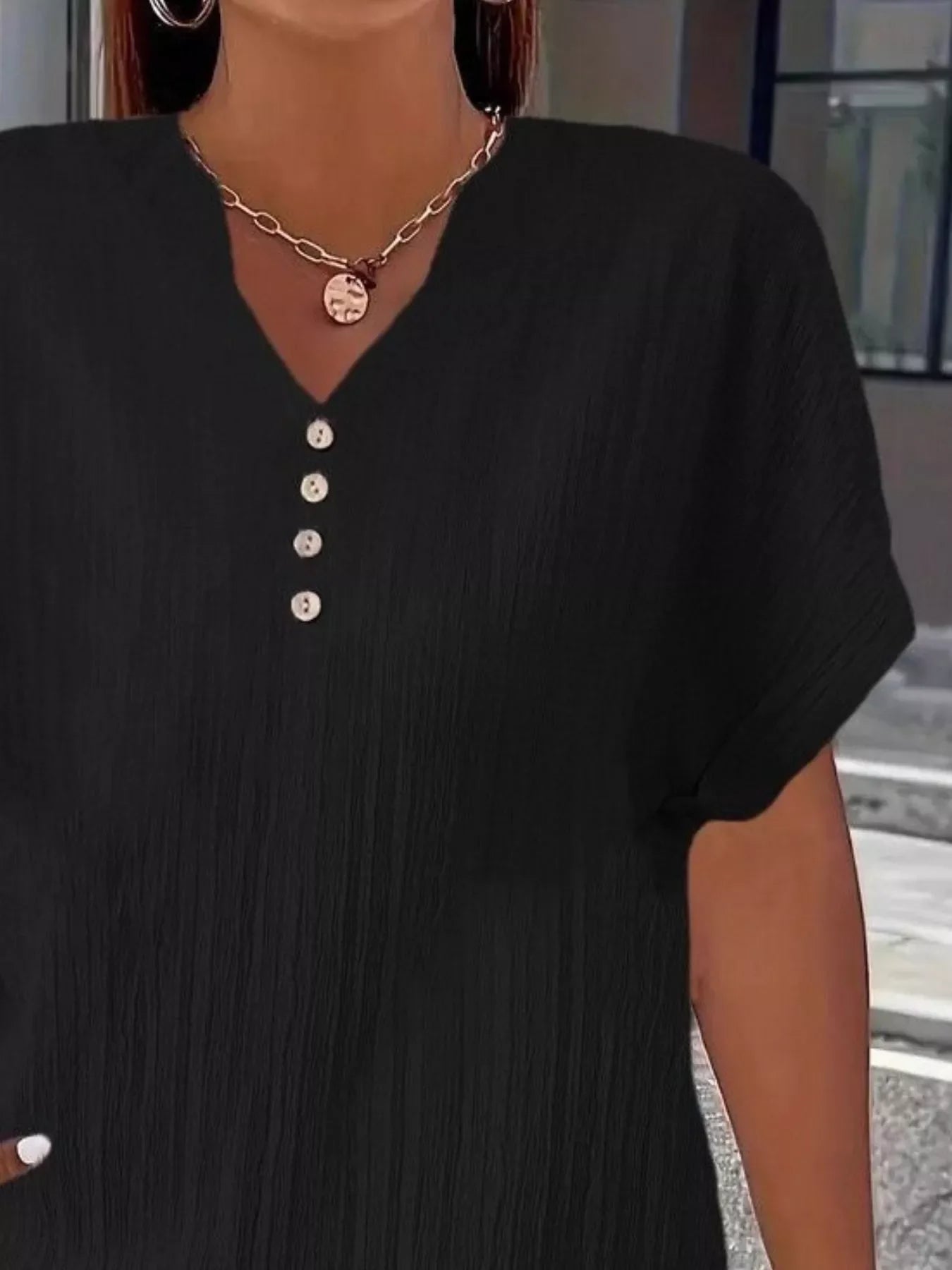 Plus size notched short sleeve textured top with decorative button in 100% polyester