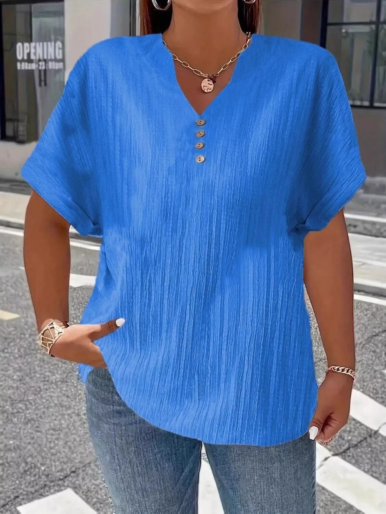 Plus size notched short sleeve textured top with decorative button in 100% polyester