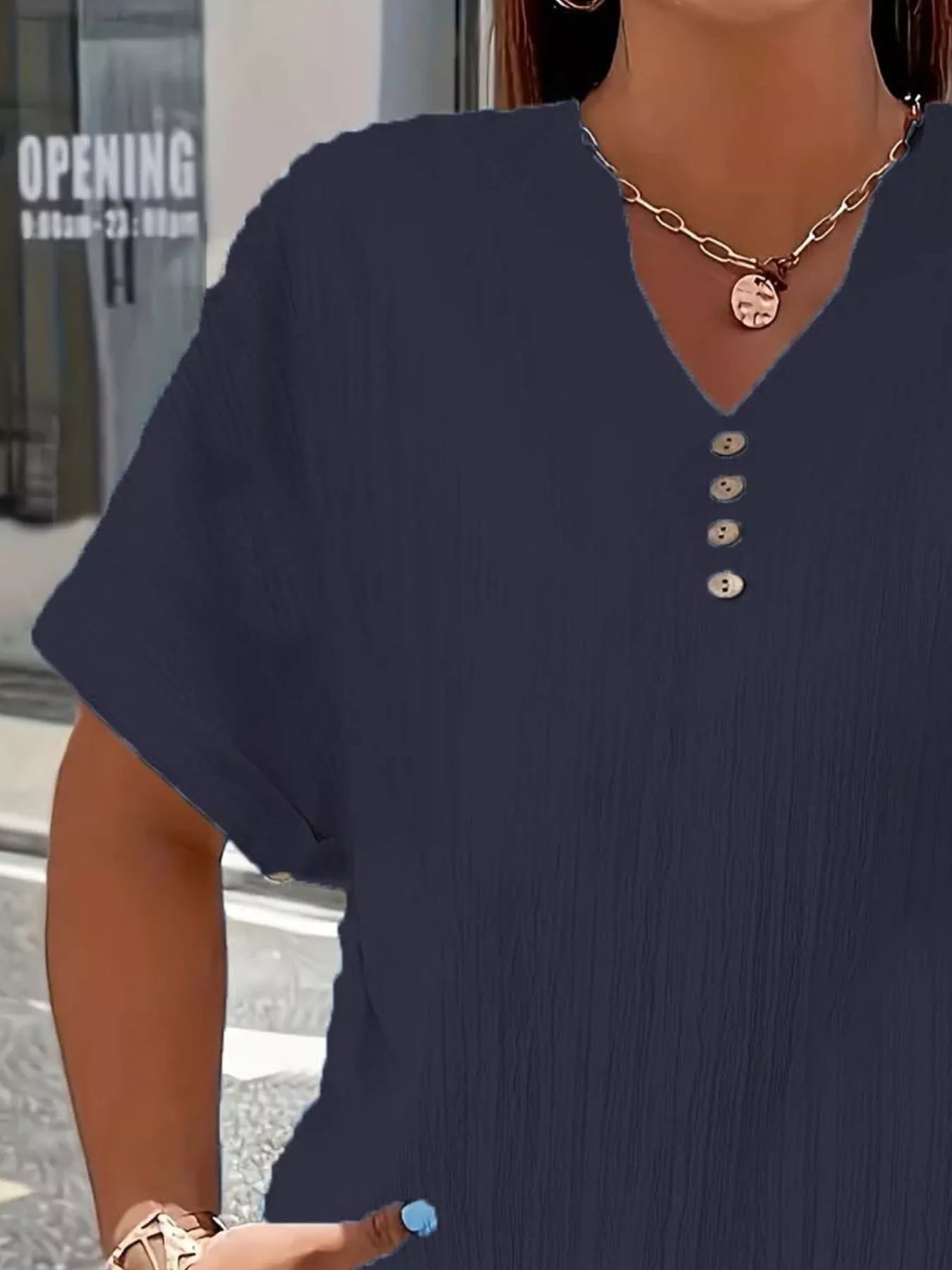 Plus size notched short sleeve textured top with decorative button in 100% polyester
