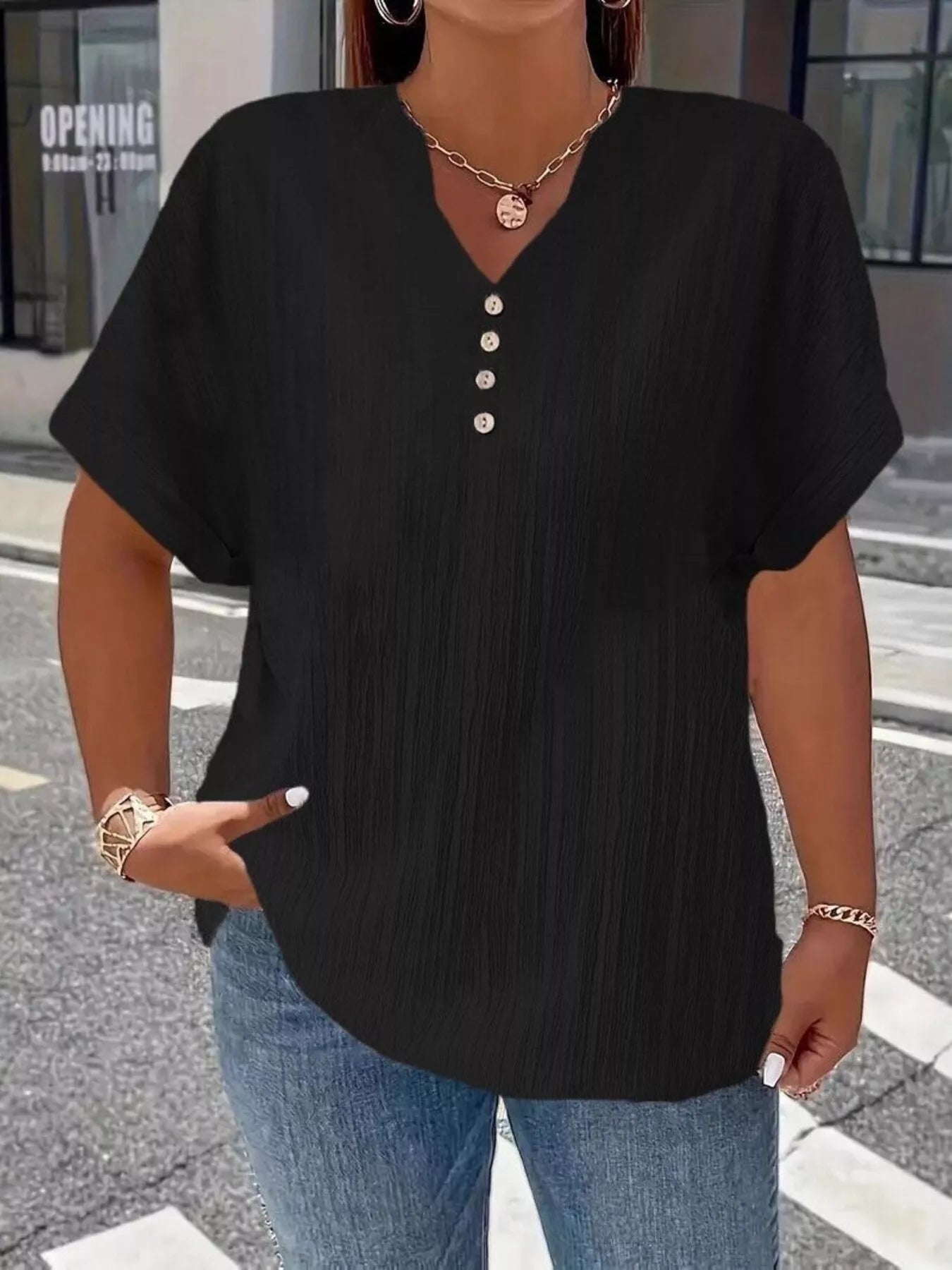Plus size notched short sleeve textured top with decorative button in 100% polyester