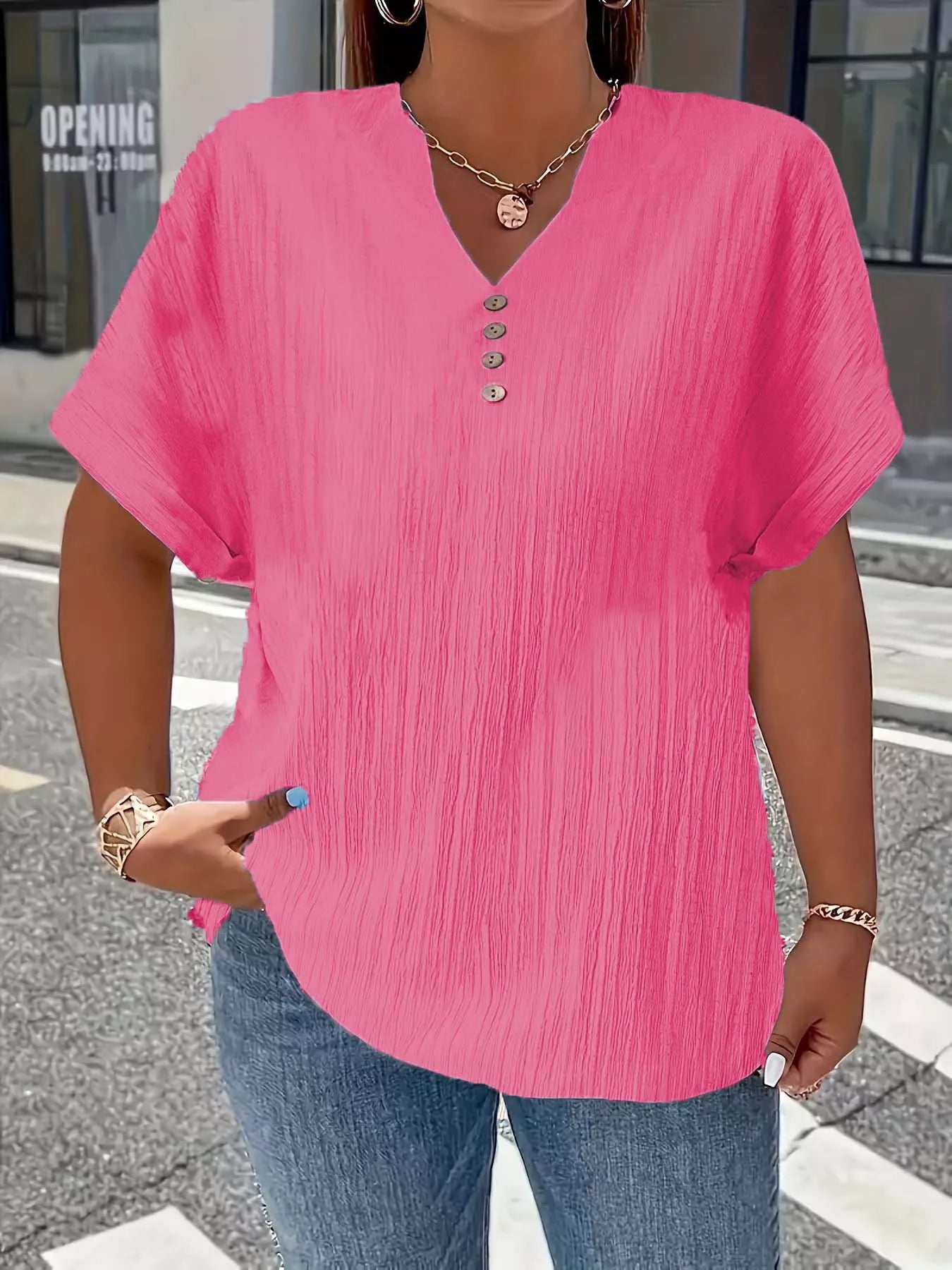 Plus size notched short sleeve textured top with decorative button in 100% polyester